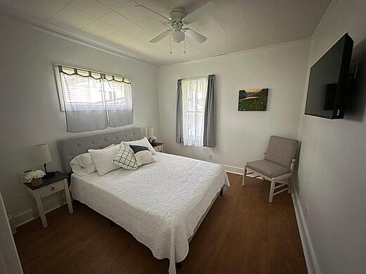 Master Bedroom with Queen Bed and TV