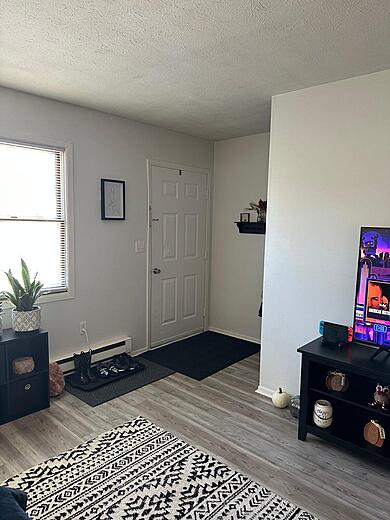 Entryway to Living Room and Upstairs